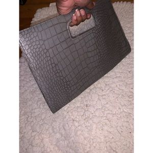 Hand held leather clutch